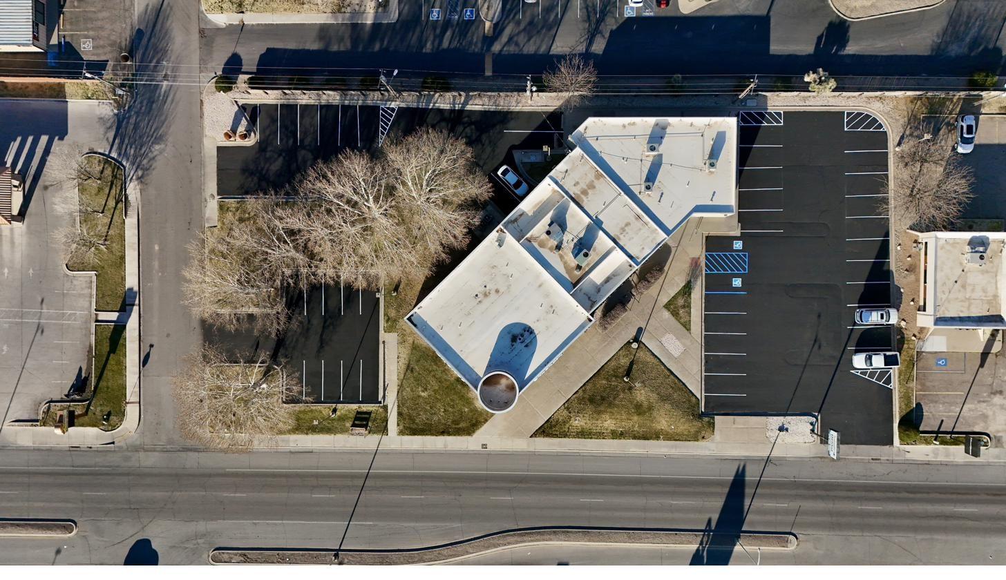 Aerial drone view of completed parking lot with full striping and ADA layout