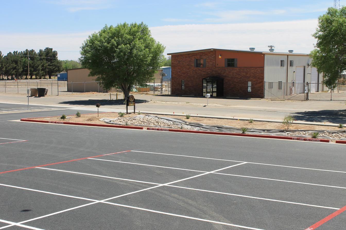 Fire lane stenciling and red curb painting in a finished commercial lot