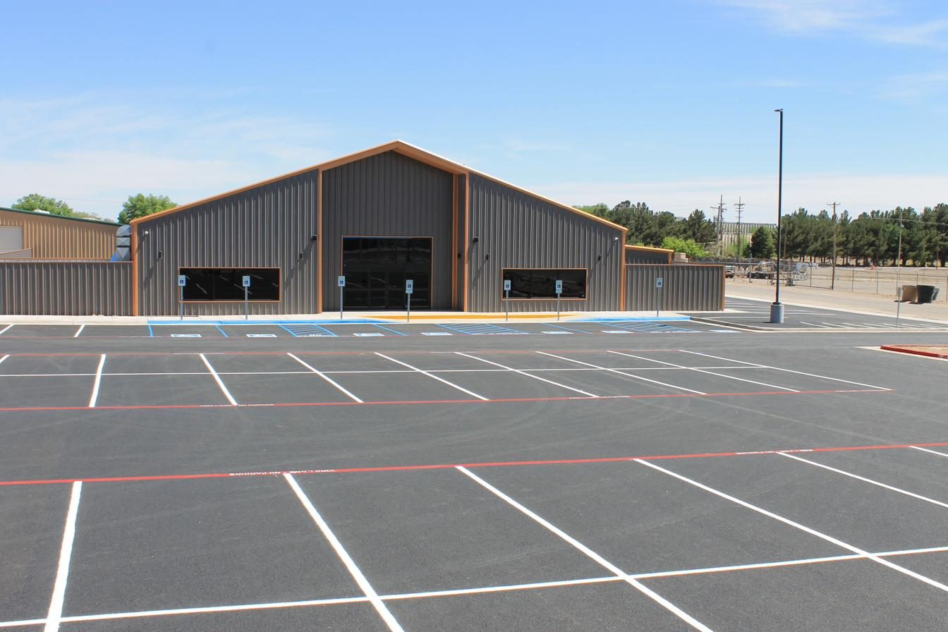 Freshly striped commercial parking lot with crisp white parking stalls