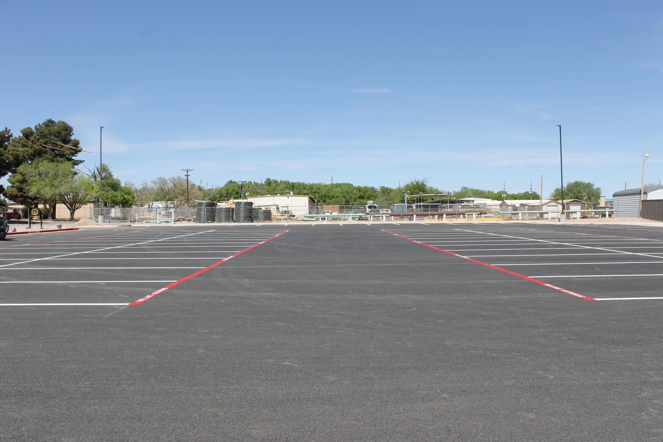 View across a parking lot with red fire lane curb in the foreground
